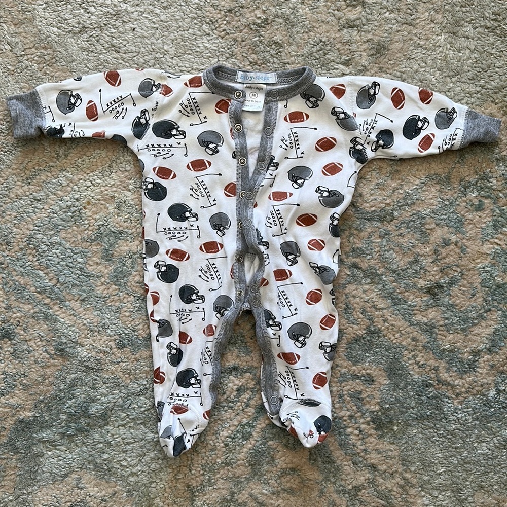 Baby steps football onesie.